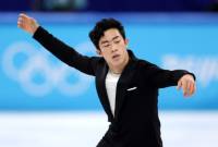 Le patineur artistique américain Nathan Chen établit le record du monde du programme court 
aux Jeux olympiques de Pékin