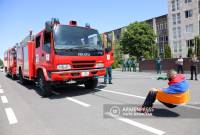 Record holder Yuri Sakunts pulls two fire-rescue vehicles with teeth seeking to set a new 
Guinness record